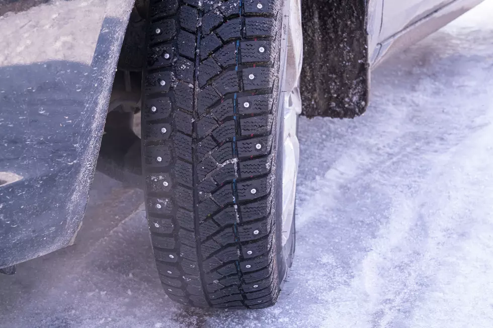 a car wheel with spikes in the snow